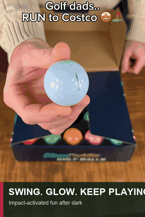 Golfer hitting an impact-activated glow ball at night