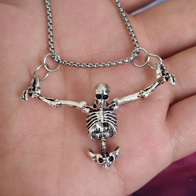 Silver-tone articulated skeleton pendant necklace