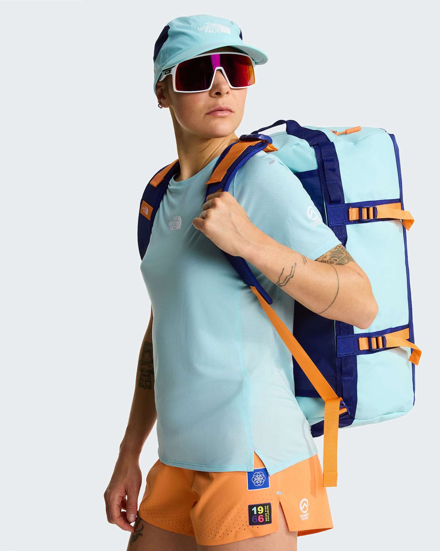 Base Camp Duffel-Tasche 50L – S – Canal Blue-Bold Blue-Papaya