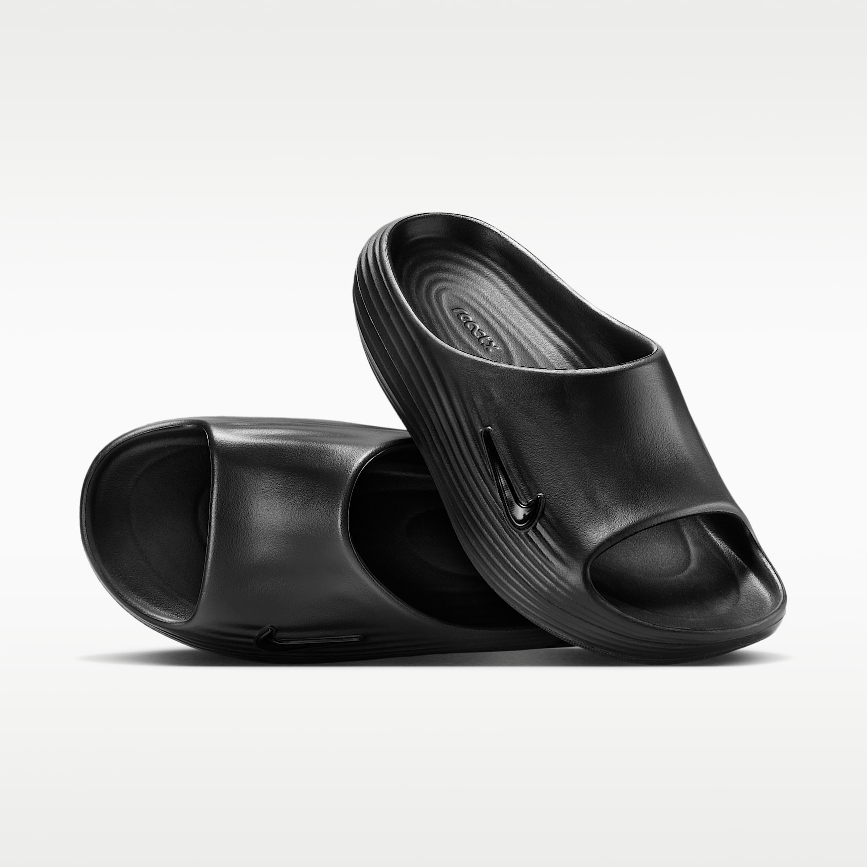 Nike ReactX Rejuven8 Slides (Damen) – Schwarz/Schwarz/Schwarz
