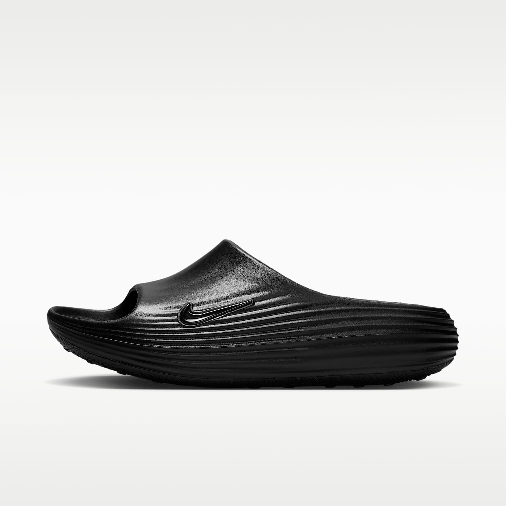Nike ReactX Rejuven8 Slides (Damen) – Schwarz/Schwarz/Schwarz