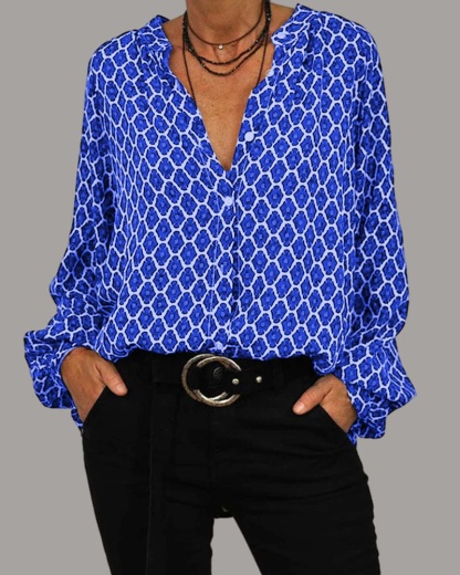 Blue and cream geometric print V-neck blouse with cuffed long sleeves