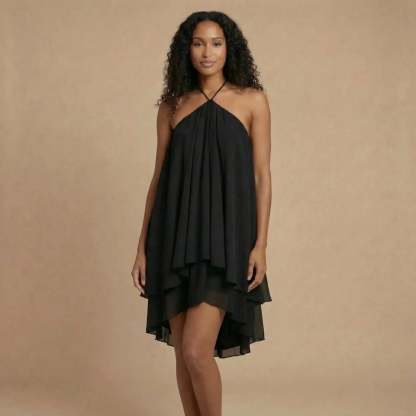 Black halter backless mini dress with flowing asymmetric chiffon hem for women
