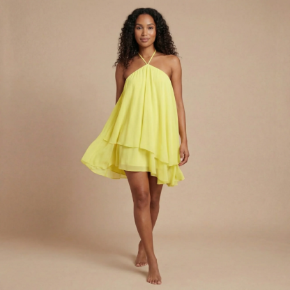 Yellow chiffon halter mini dress with flowing asymmetric layered hem for women