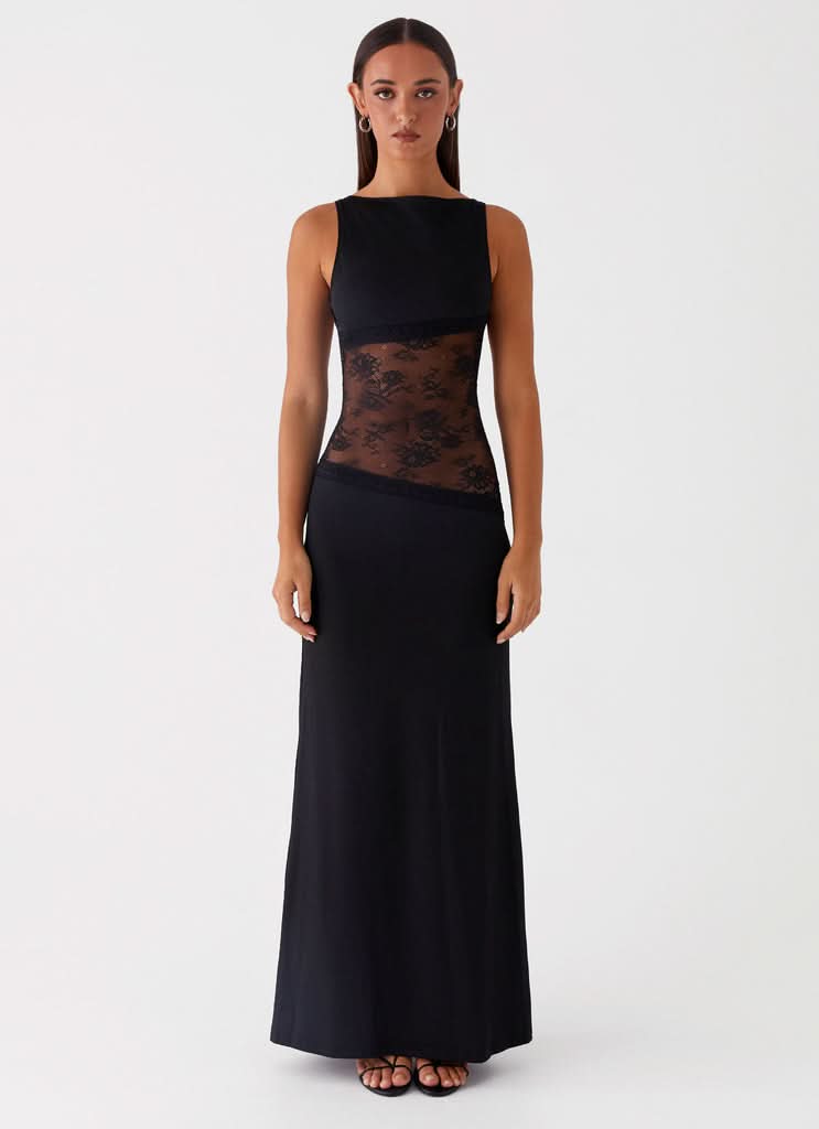 Black sleeveless maxi dress with sheer lace cutout at waist