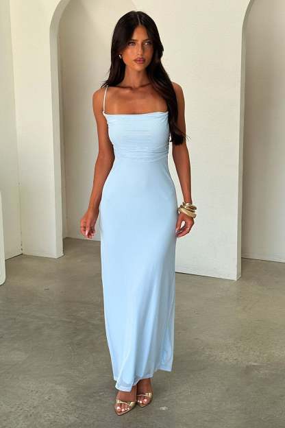 Sleeveless light blue maxi dress with thin straps and fitted silhouette