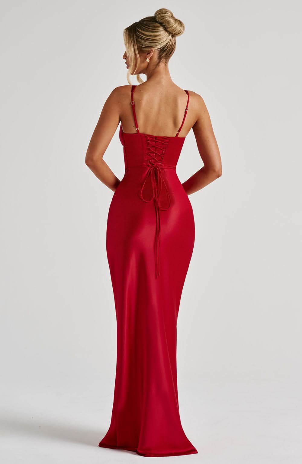 Back view of red corset maxi dress showing lace-up corset detail