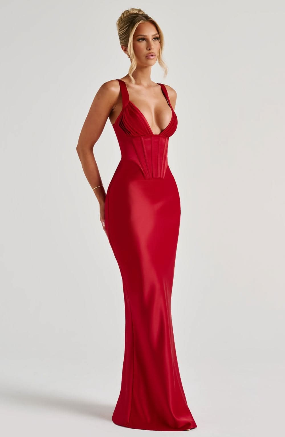 Front view of red corset maxi dress with fitted bodice and flowing skirt