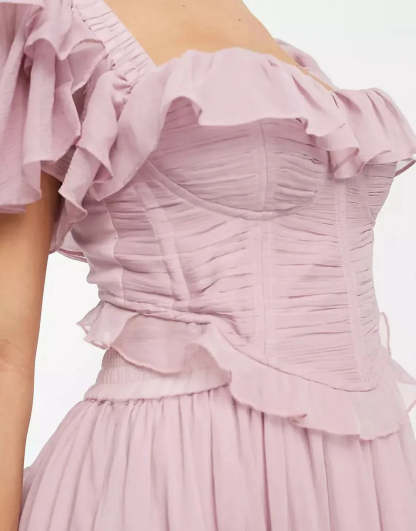 Close-up of ruched bodice and ruffled off-shoulder neckline detail