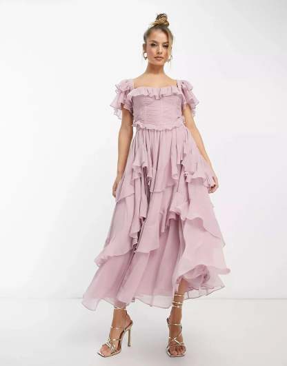 Blush pink ruffle midi dress with off-shoulder neckline and layered skirt