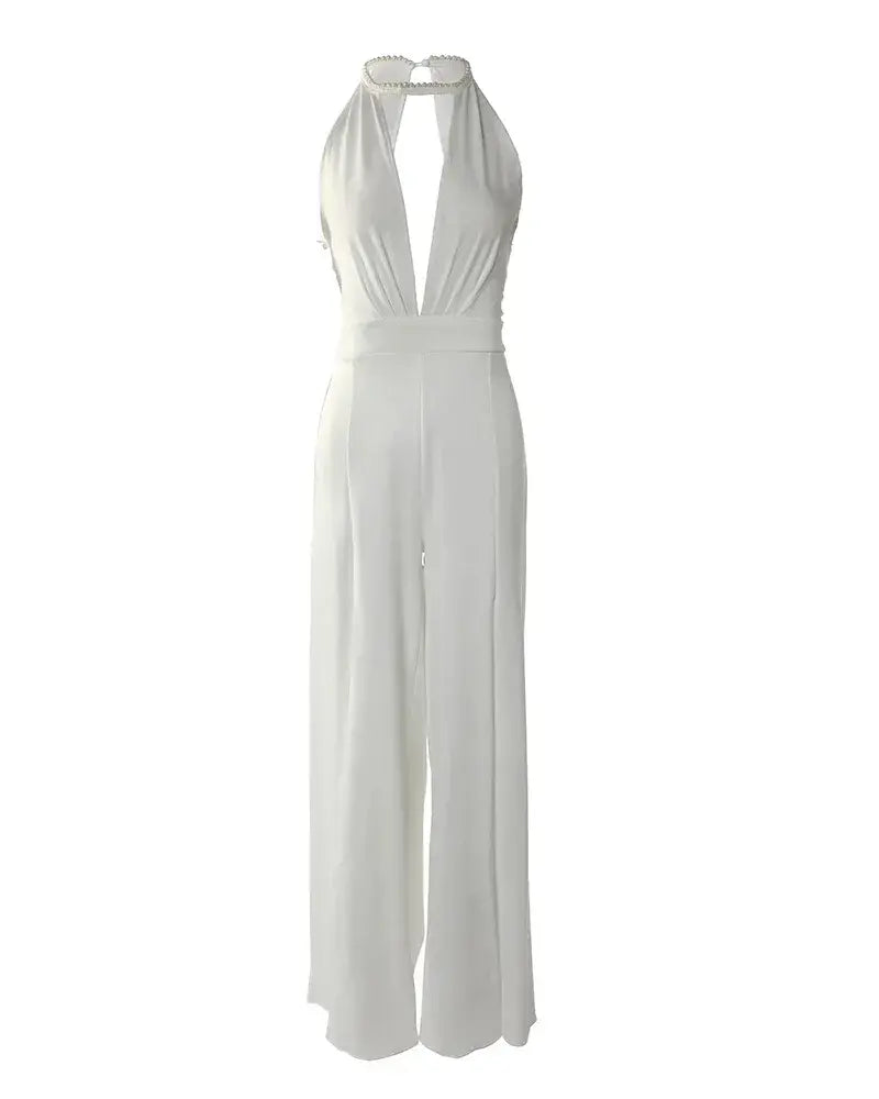 Full length flat lay of ivory backless jumpsuit with halter closure and wide pants