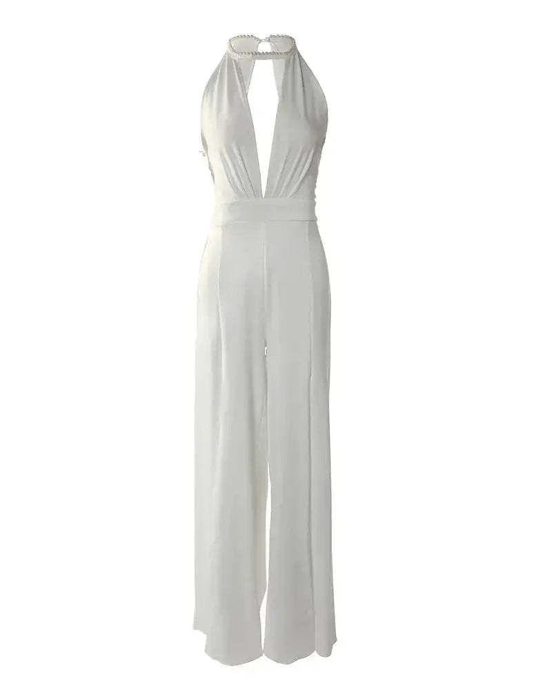 Full length flat lay of ivory backless jumpsuit with halter closure and wide pants