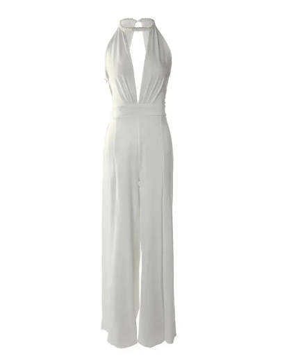 Full length flat lay of ivory backless jumpsuit with halter closure and wide pants