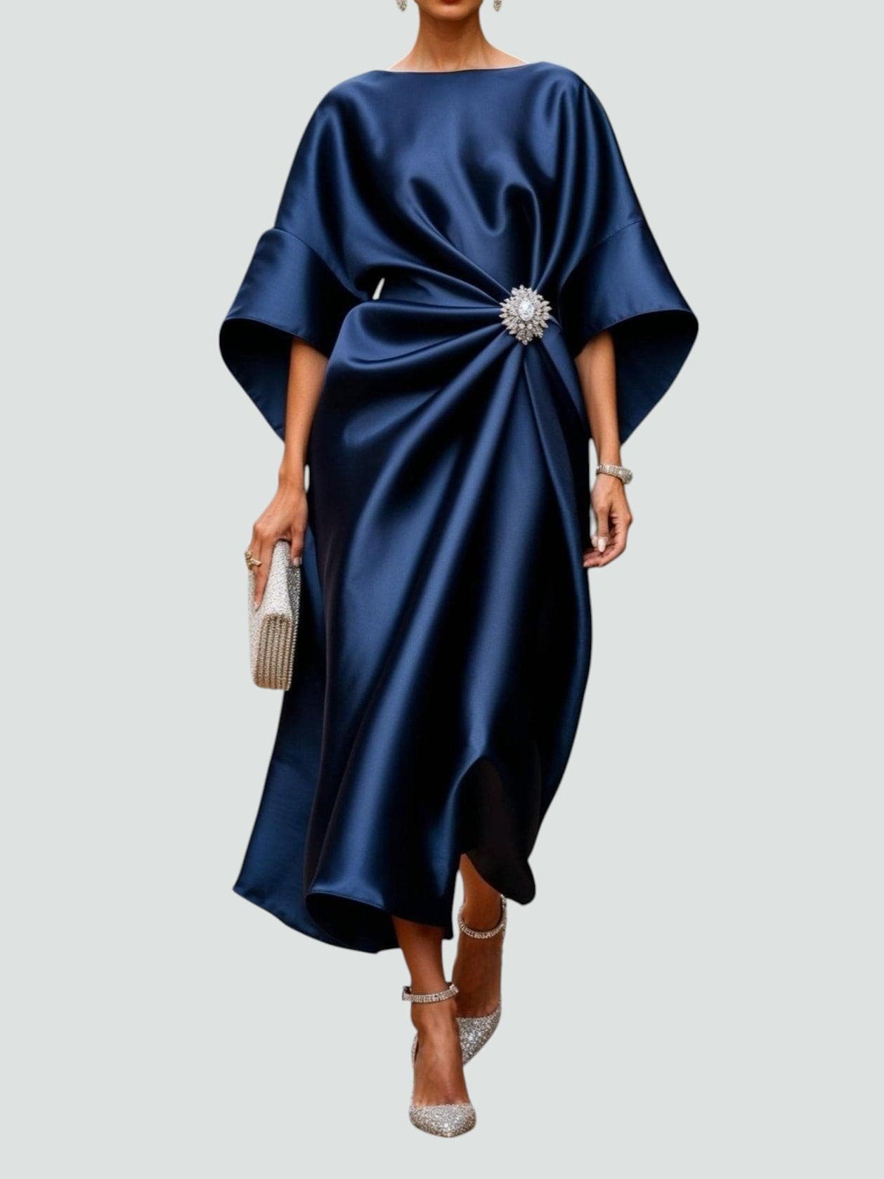 Navy satin midi dress with draped bodice and crystal brooch embellishment