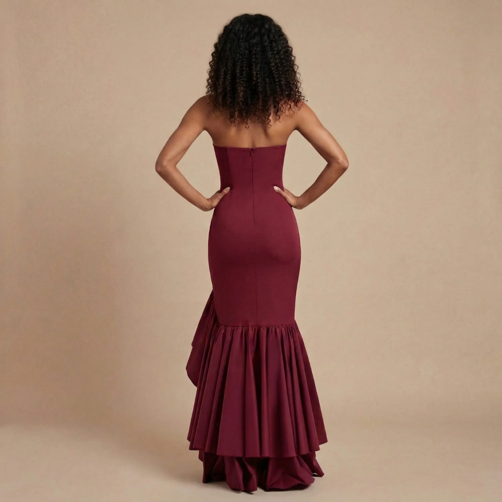 Back view of burgundy strapless maxi dress with tiered ruffle skirt