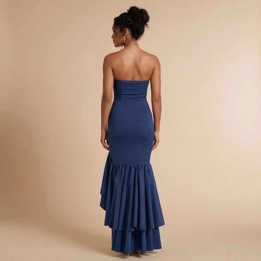 Back view of navy strapless maxi dress with tiered ruffle layers