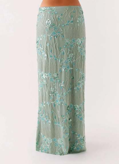 Close-up of sage sequin maxi skirt with silver and turquoise beading