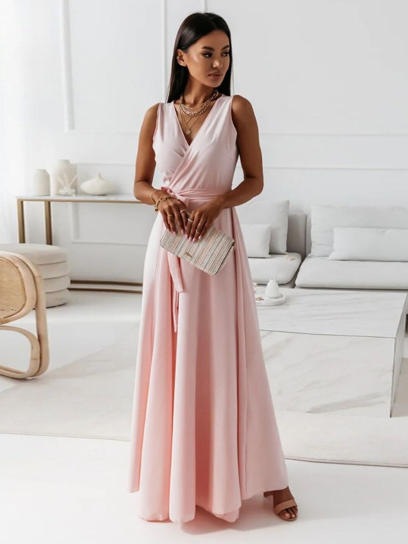 Blush pink wrap maxi dress with sleeveless v-neckline and flowing skirt