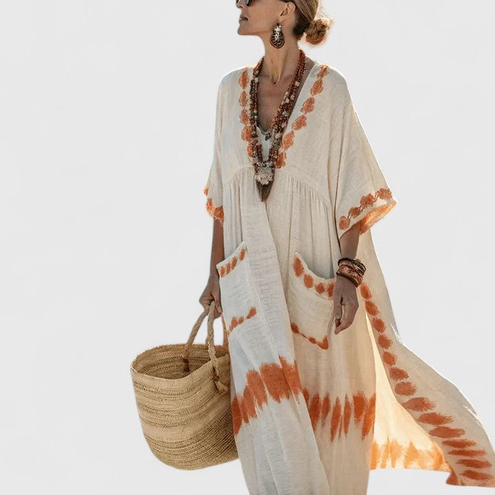 Natural linen maxi dress with rust tie-dye trim and flutter sleeves