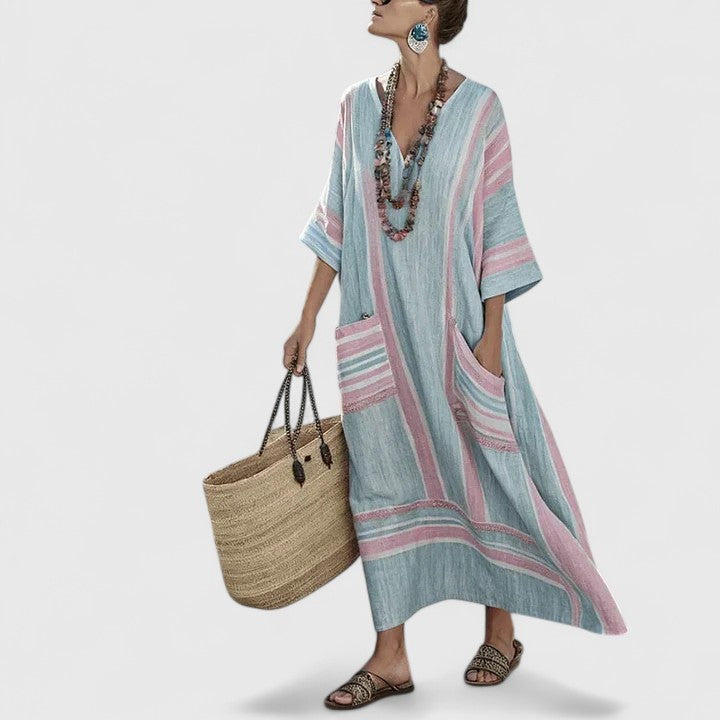 Blue-green maxi dress with pink striped trim and patch pockets