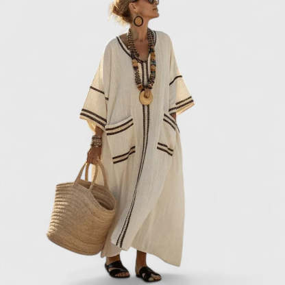 Cream linen maxi dress with black trim stripes and flutter sleeves