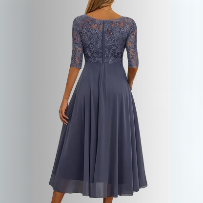 Navy lace midi dress back view with three-quarter sleeves and pleated chiffon skirt