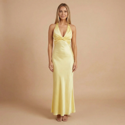 Pale yellow halter maxi dress with twisted front detail and deep V-neckline