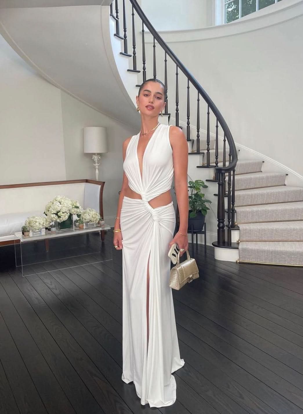 White cutout maxi dress with deep v-neck and twisted waist openings