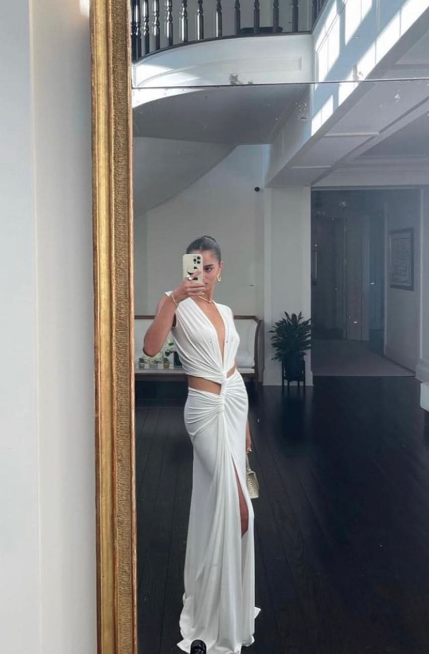 Ivory maxi dress with front cutout detail and high leg slit, mirror selfie view