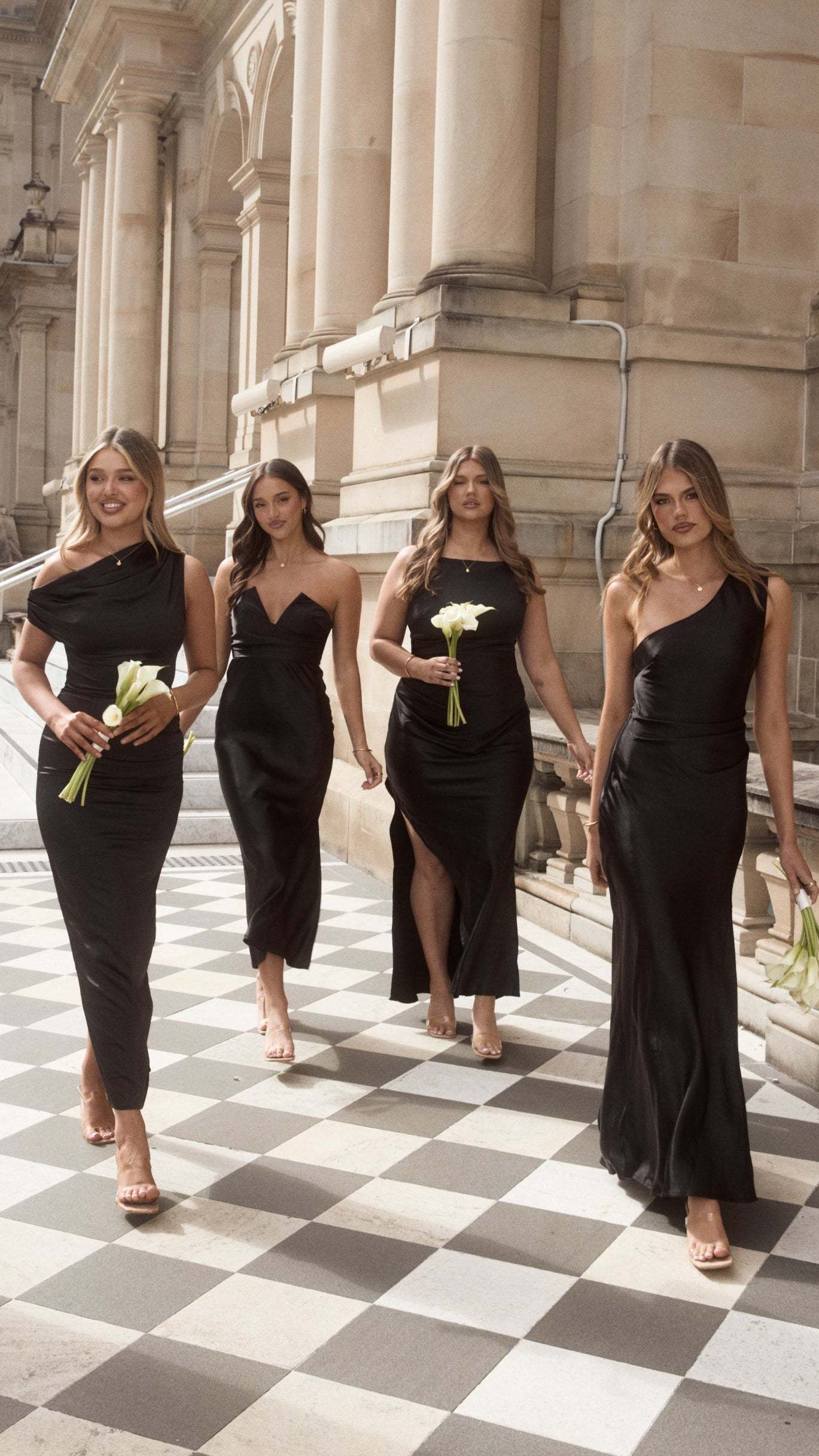 Black backless maxi dress with one-shoulder neckline and high slit