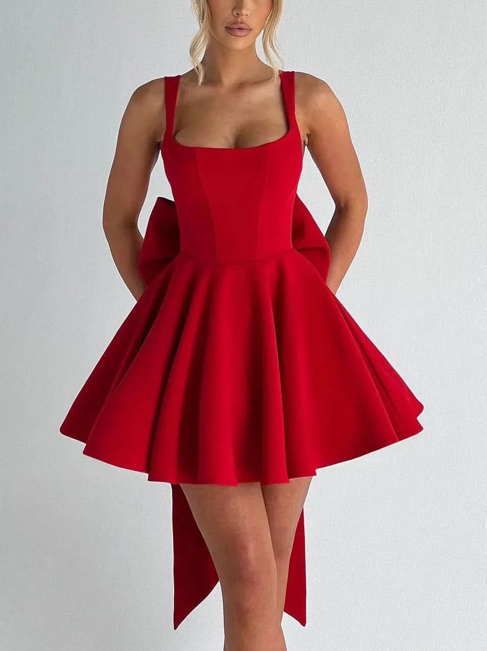 Red sleeveless mini dress with fitted bodice and full skirt silhouette