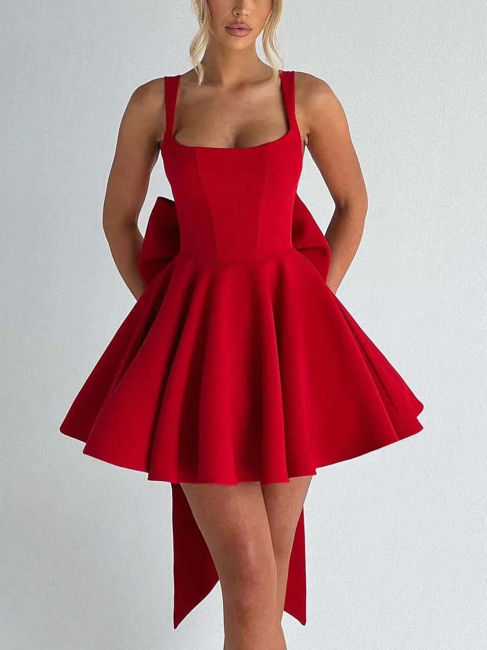 Red sleeveless mini dress with fitted bodice and full skirt silhouette