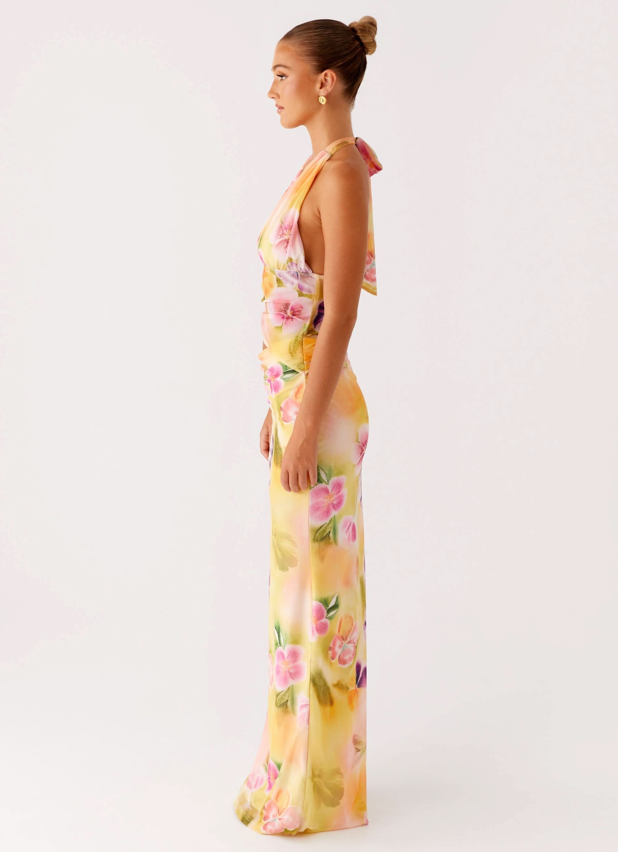 Side profile of floral wrap midi dress with draped fabric