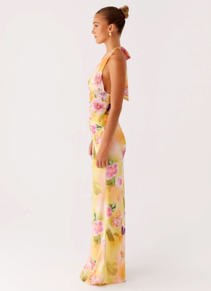 Side profile of floral wrap midi dress with draped fabric