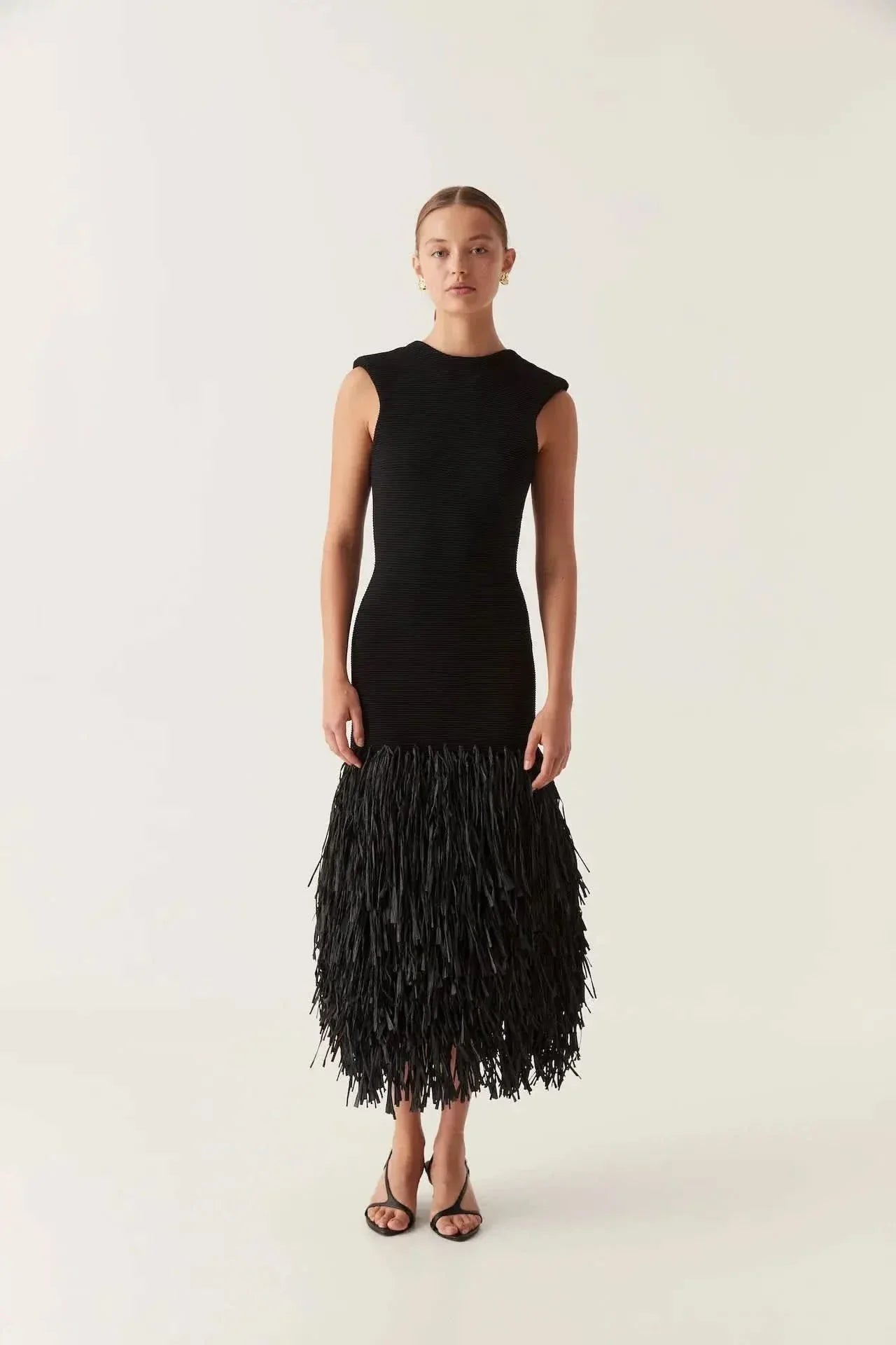 Black knit midi dress with crew neckline and layered fringe hem for women