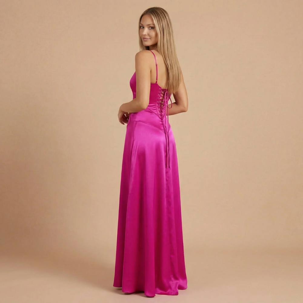 Magenta corset maxi dress back view with lace-up corset and flowing hem