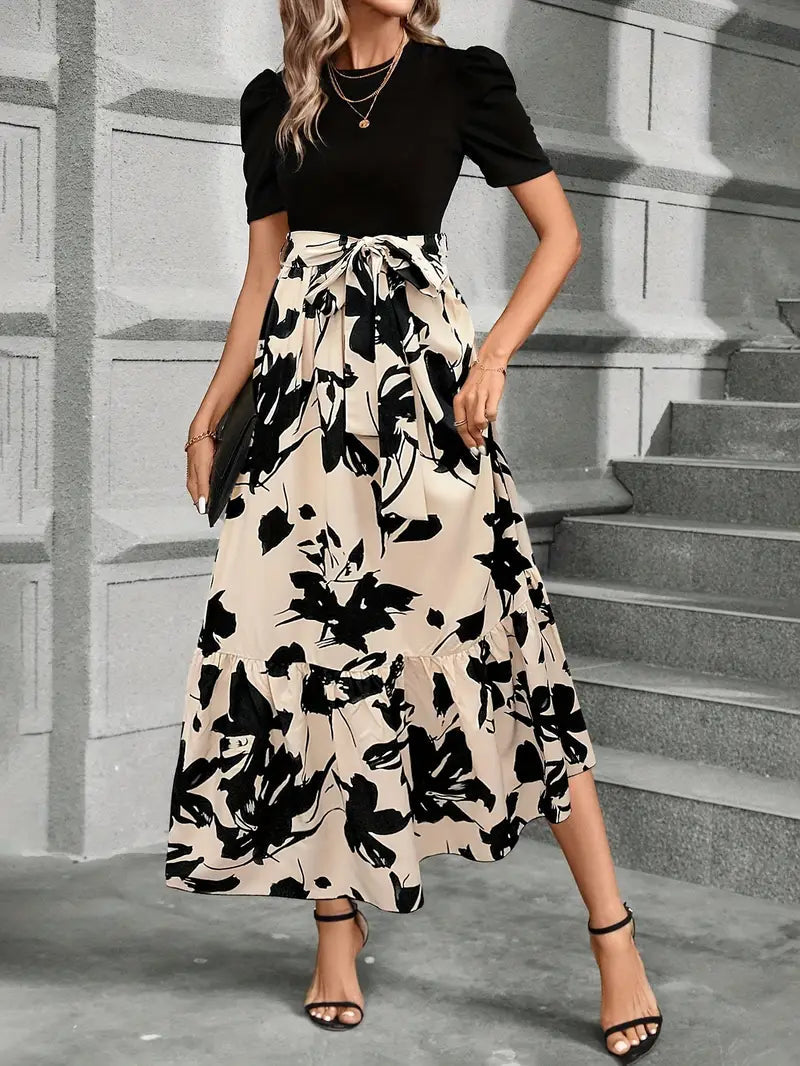 Black puff sleeve bodice with cream botanical print maxi skirt and tiered hem