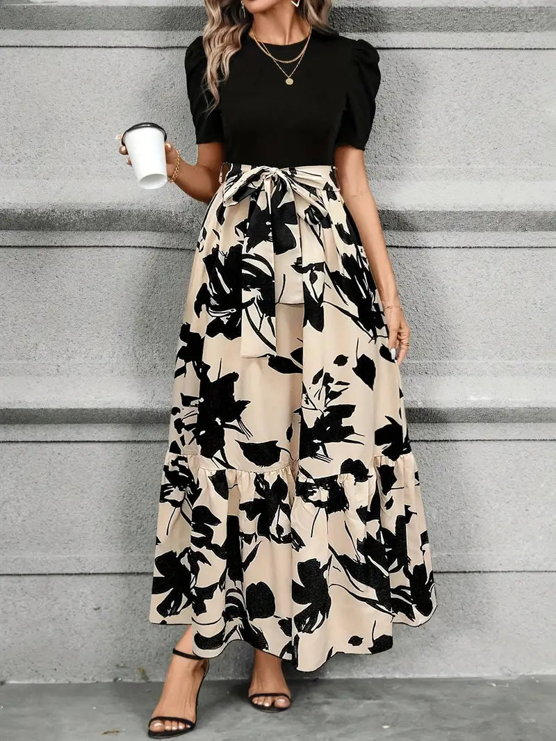 Cream maxi dress with black floral print and ruffled hemline for wedding guest