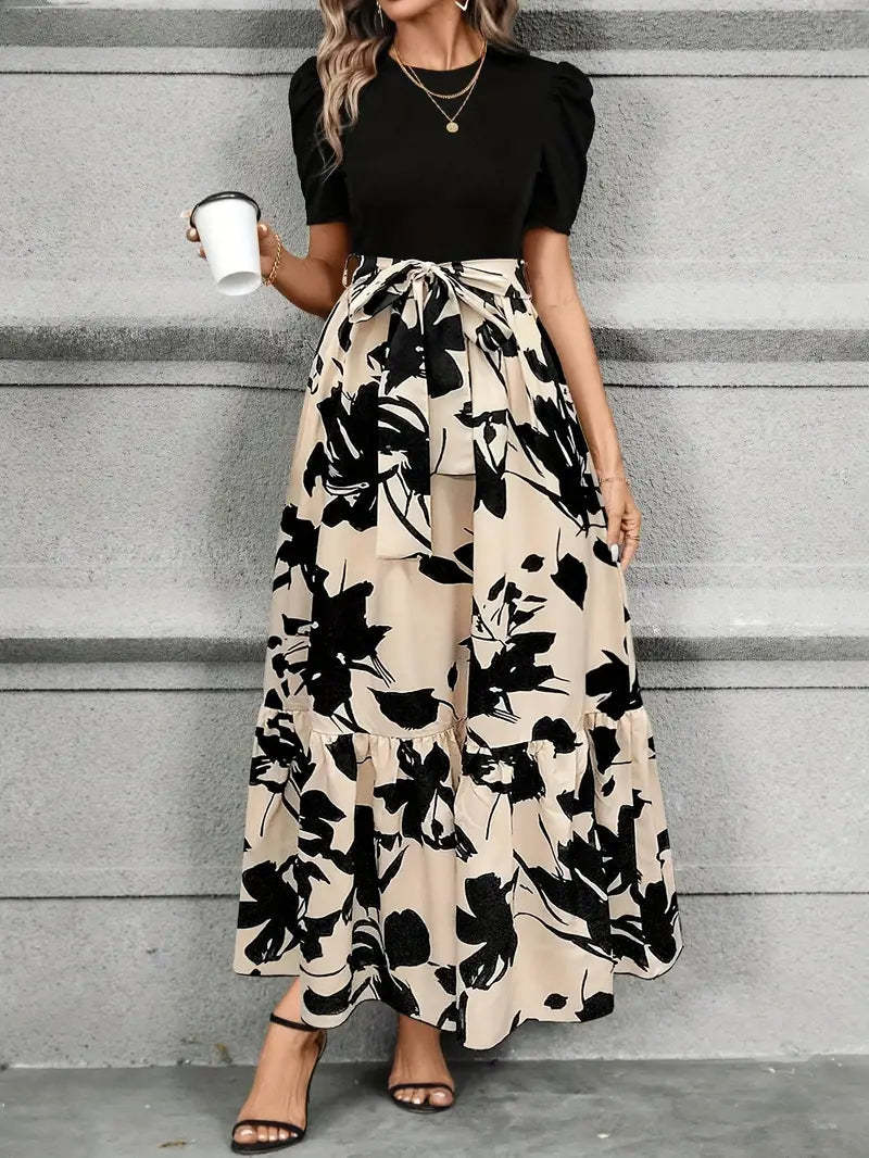 Cream maxi dress with black floral print and ruffled hemline for wedding guest