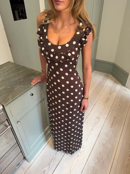 Brown polka dot maxi dress with ruffled off-shoulder neckline detail