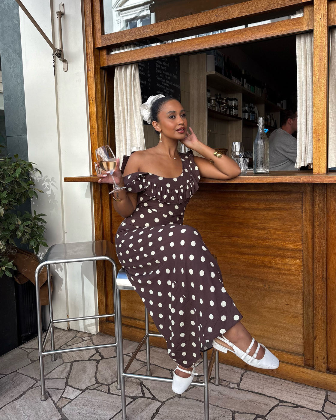 Brown polka dot maxi dress with off-shoulder ruffle sleeves and fitted bodice