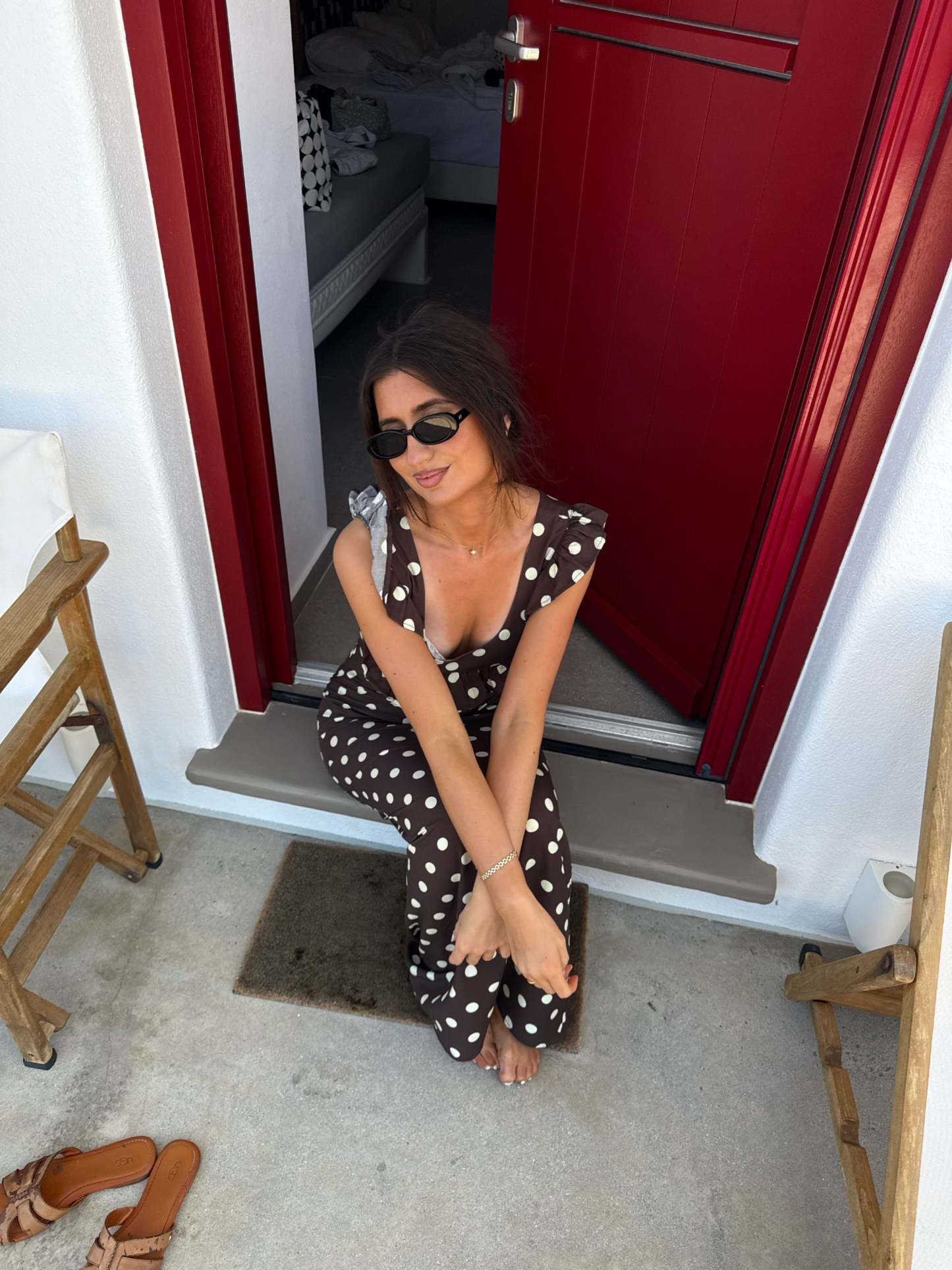 Brown polka dot maxi dress with ruffled cap sleeves and v-neckline
