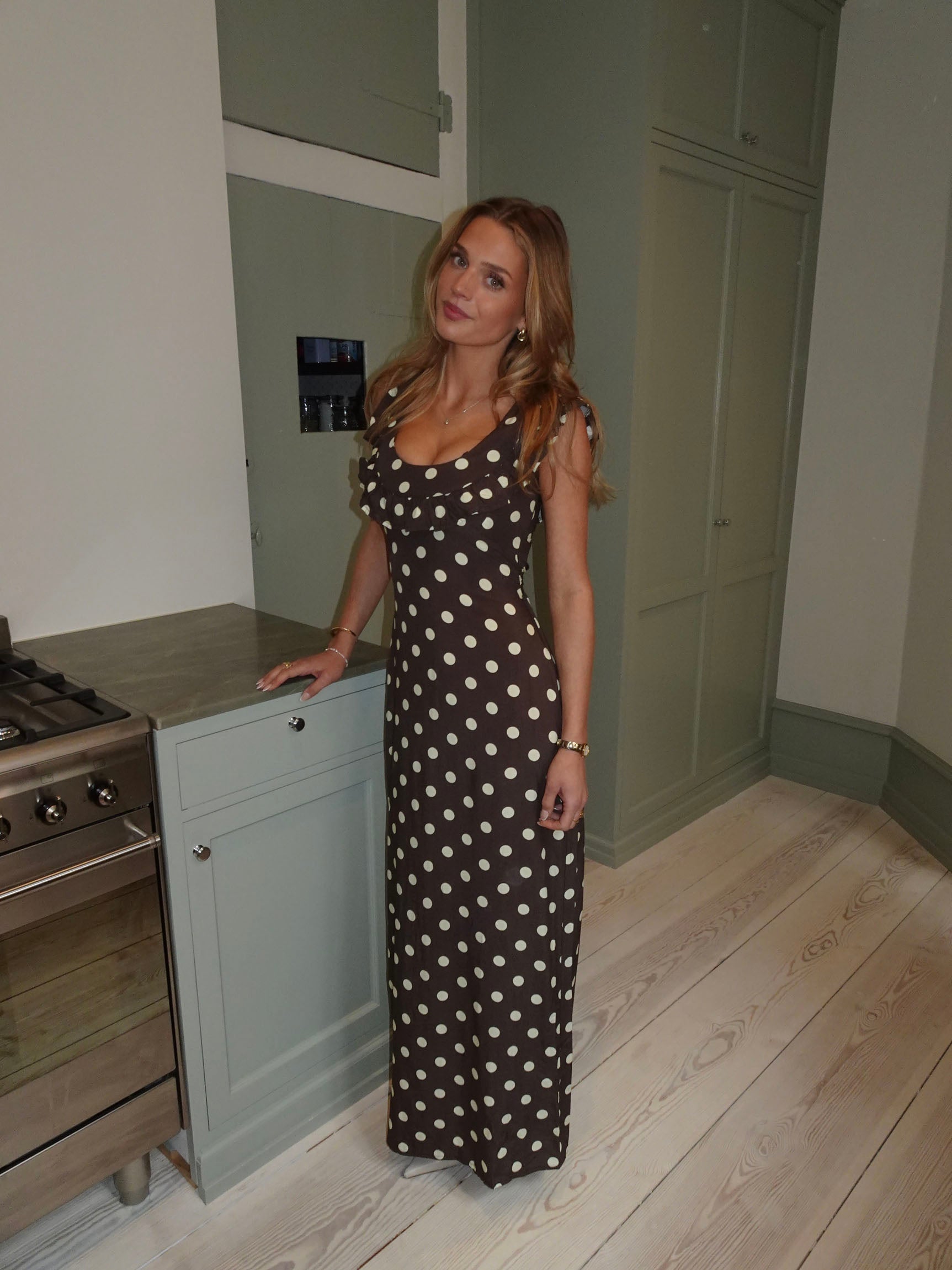 Brown polka dot maxi dress with cap ruffle sleeves and fitted waist