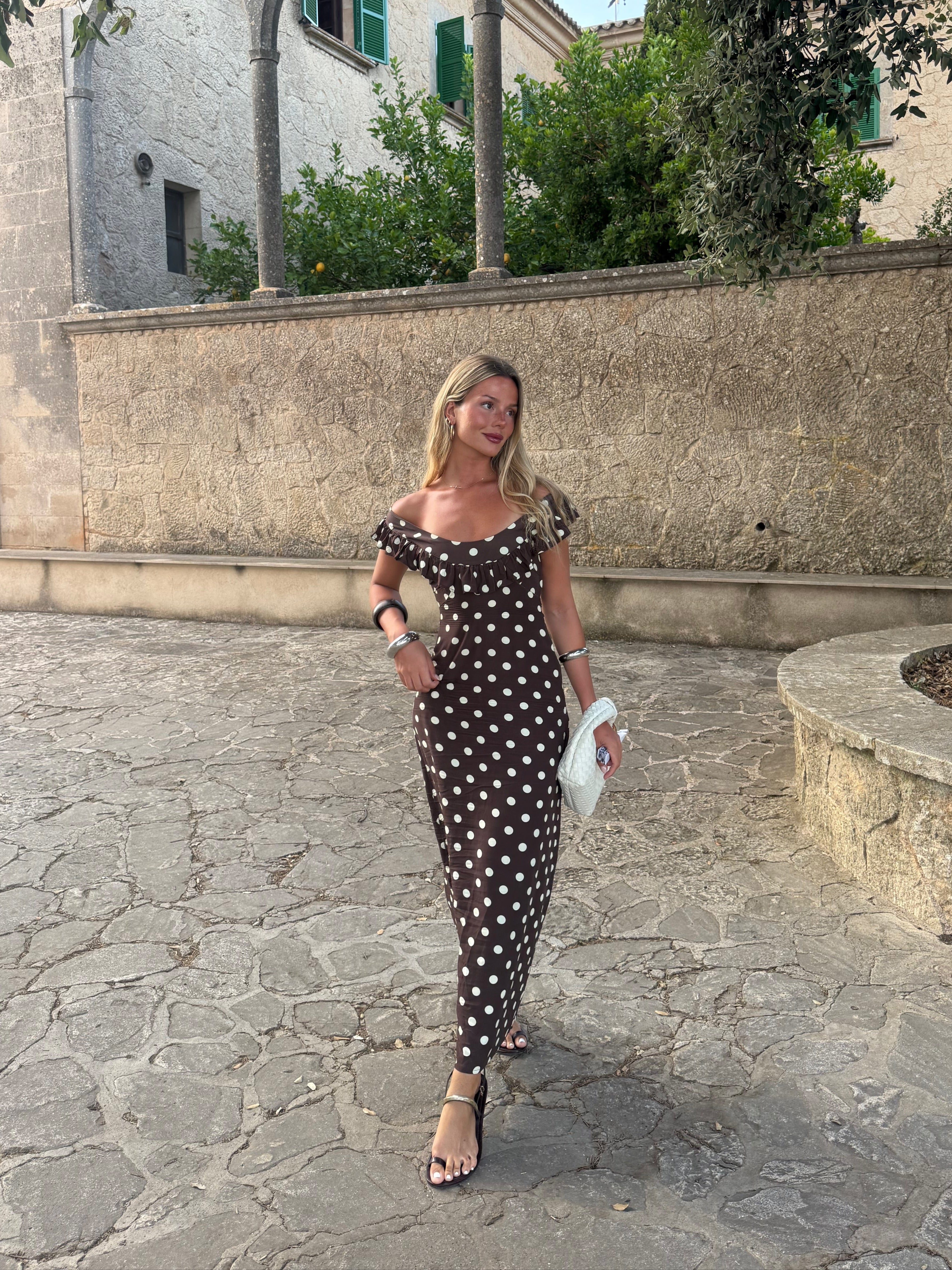 Full-length brown polka dot maxi dress with ruffled off-shoulder top