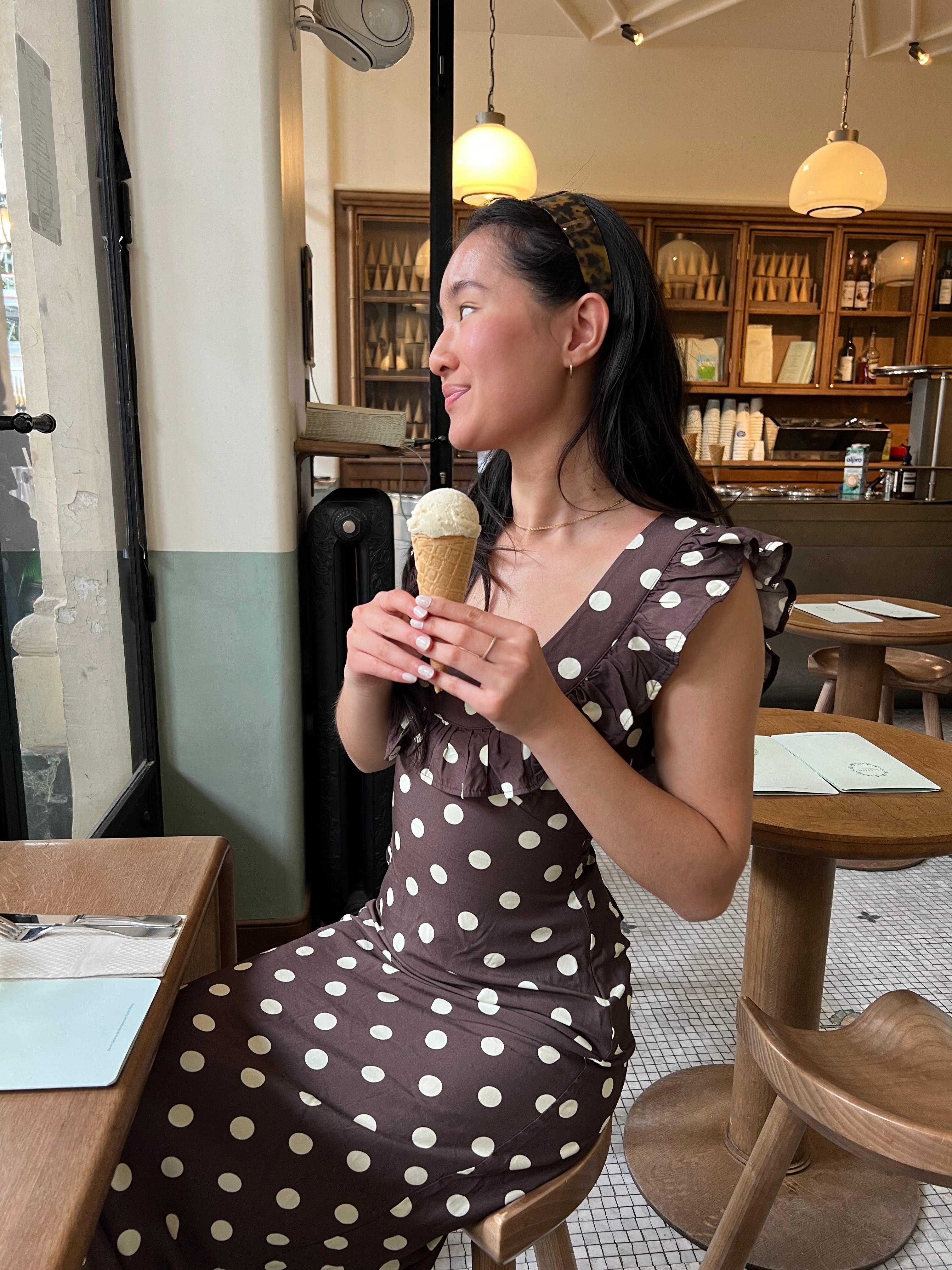 Close-up front view of brown polka dot maxi dress ruffled bodice