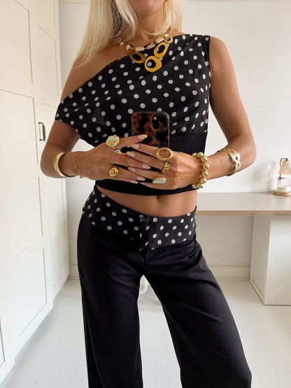 Black polka dot crop top with ribbed waistband and white dot pattern
