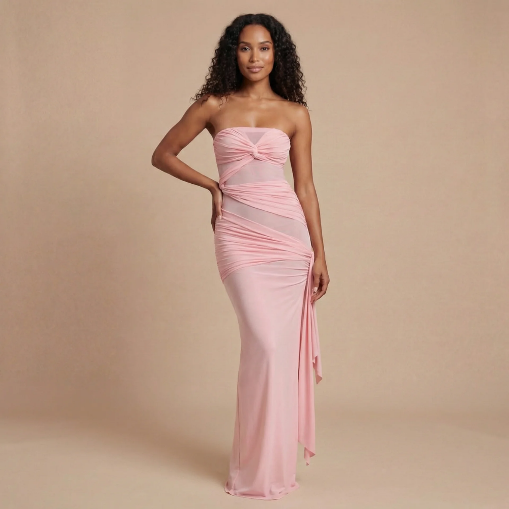 Blush pink strapless ruched maxi dress with asymmetrical side drape for women
