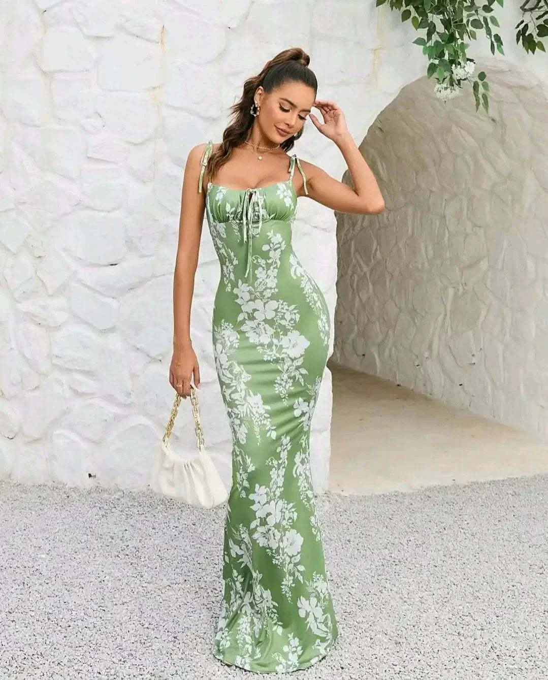 Sage green floral maxi dress with tie-shoulder straps and ruched bodice
