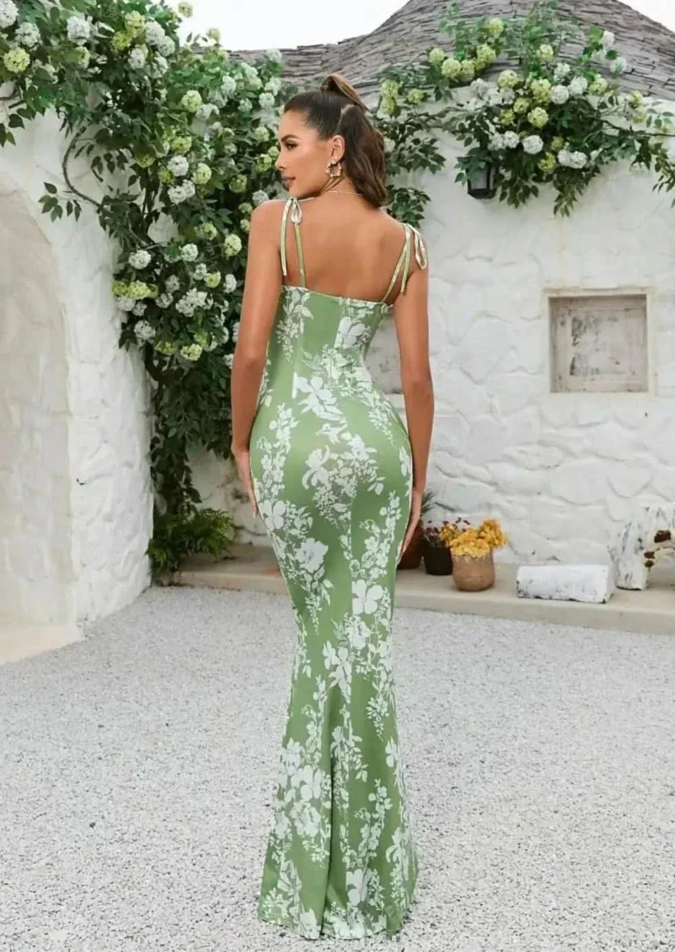 Back view of sage green floral maxi dress with adjustable tie straps