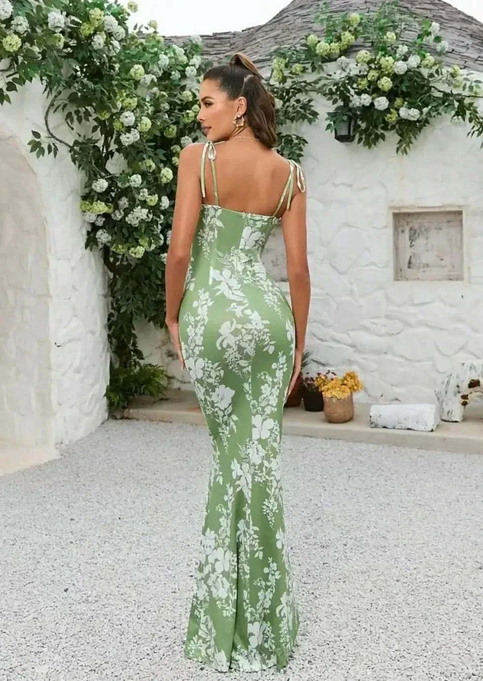 Back view of sage green floral maxi dress with adjustable tie straps